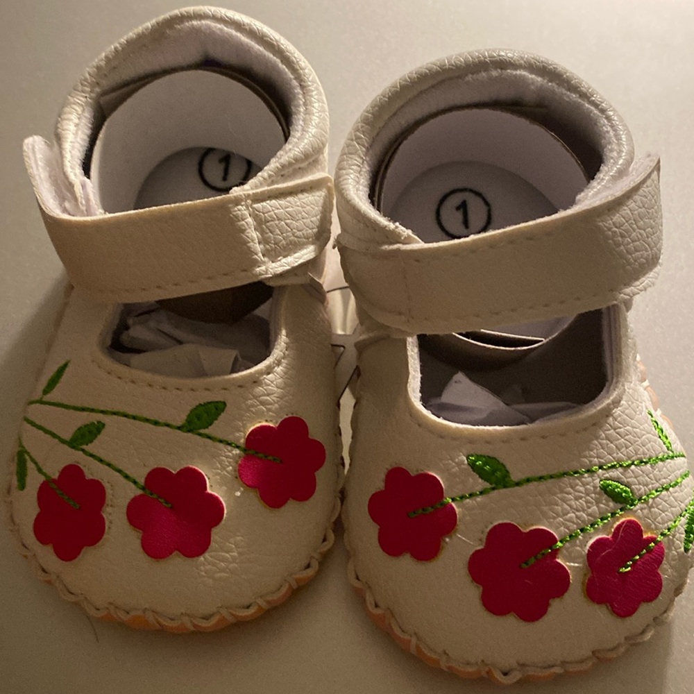 White Leather with flowers baby shoes.